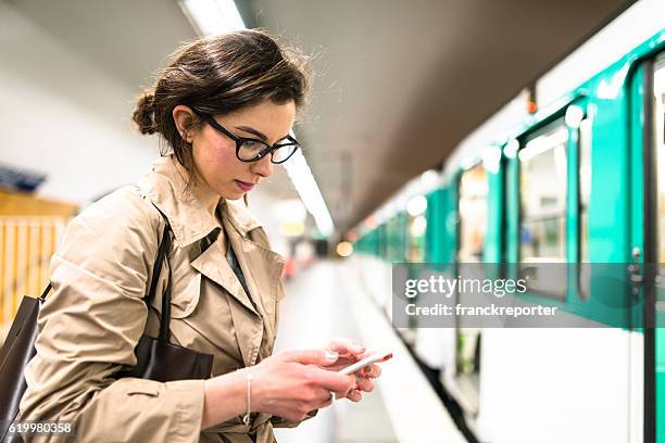 waiting the train in paris subway station - subway paris stock pictures, royalty-free photos & images