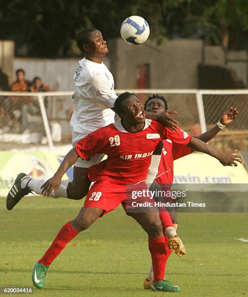 Indian Football - Churchill Bros. FC player Odafe and Air India's Udofia and Tayo fights for the possession of the ball during their I-League...