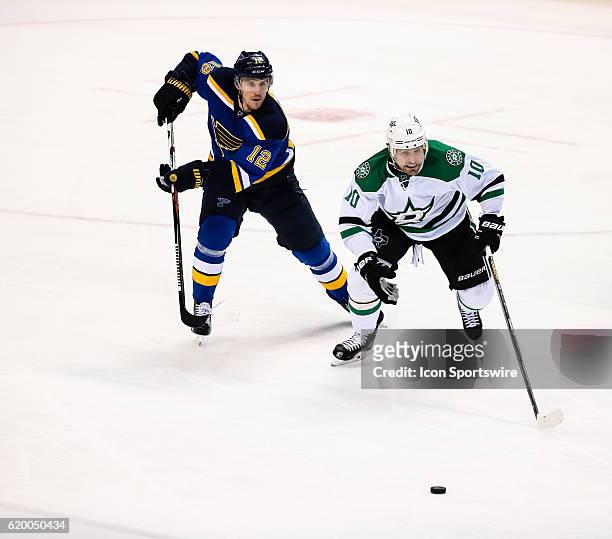 Dallas Stars left wing Patrick Sharp skates across the ice while being pursued by St. Louis Blues center Jori Lehtera during the third period of a...