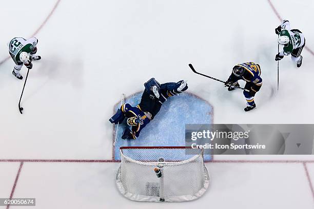 Dallas Stars center Colton Sceviour looks to shoot the puck while St. Louis Blues goalie Brian Elliott dives to attempt the save during a NHL Western...