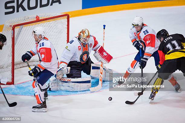 Tomi Leivo of Lappeenranta challenges Geoff Platt, Joacim Eriksson and Philip Holm of Vaxjo during the Champions Hockey League Round of 16 match...