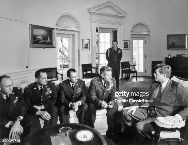 1960s CUBAN MISSILE CRISIS OCTOBER 1962 PRESIDENT JOHN F KENNEDY WITH GENERAL CURTIS LEMAY & AIDES DISCUSSE SURVEILLANCE OF CUBA