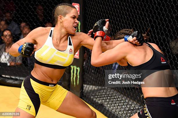 Amanda Nunes of Brazil punches Miesha Tate in their UFC women's bantamweight championship bout during the UFC 200 event at T-Mobile Arena on July 9,...