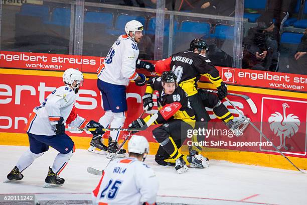 Ville Vainikainen and Saku Salminen of Lappeenranta challenges Linus Froberg and Kalle Rosen of Vaxjo during the Champions Hockey League Round of 16...