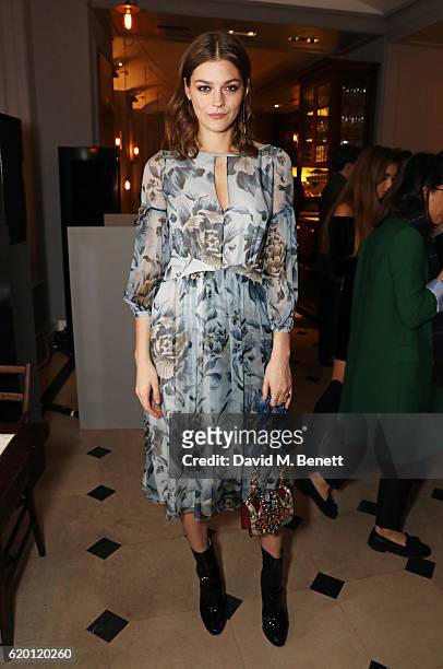 Amber Anderson, wearing Burberry, attends an event to celebrate 'The Tale of Thomas Burberry' at Burberry's all day cafe Thomas's on November 1, 2016...