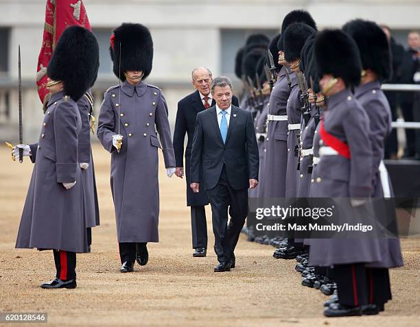 Colombian President Juan Manuel Santos, accompanied by Prince Philip, Duke of Edinburgh, inspects a guard of honour during his Ceremonial Welcome at...