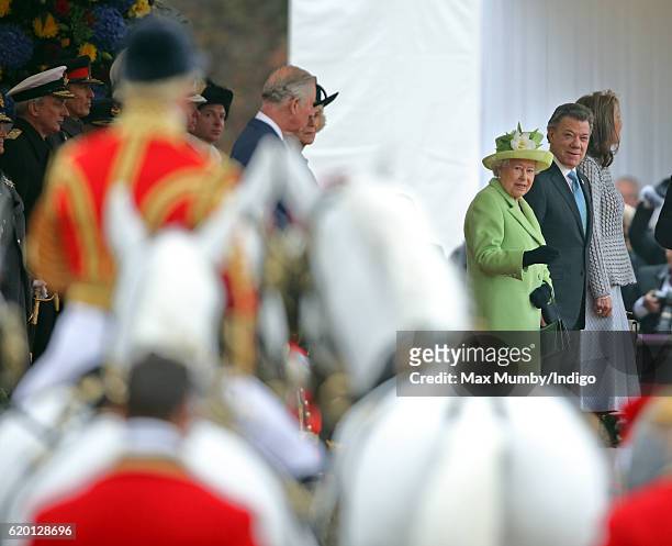 Queen Elizabeth II and Colombian President Juan Manuel Santos attend the Ceremonial Welcome for the President of Colombia at Horse Guards Parade on...