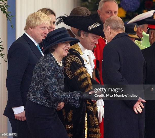 Foreign Secretary Boris Johnson looks on as Prime Minister Theresa May curtsies to Prince Philip, Duke of Edinburgh during the Ceremonial Welcome for...