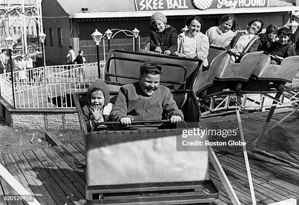 Keefe Munnow and his sister, Cindy Munnow, both of Hull, ride the children's roller coaster at Paragon Park in Hull, Mass., on April 13, 1969.