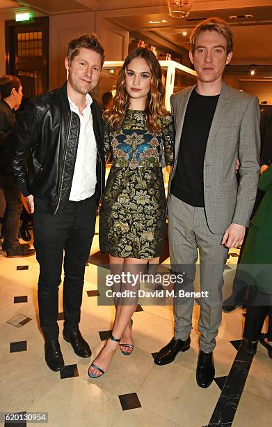 Christopher Bailey, Lily James and Domhnall Gleeson, wearing Burberry, attend an event to celebrate 'The Tale of Thomas Burberry' at Burberry's all...