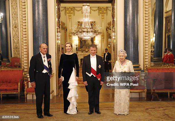 Britain's Queen Elizabeth II and her husband Britain's Prince Philip, Duke of Edinburgh , pose with Colombia's President Juan Manuel Santos and his...