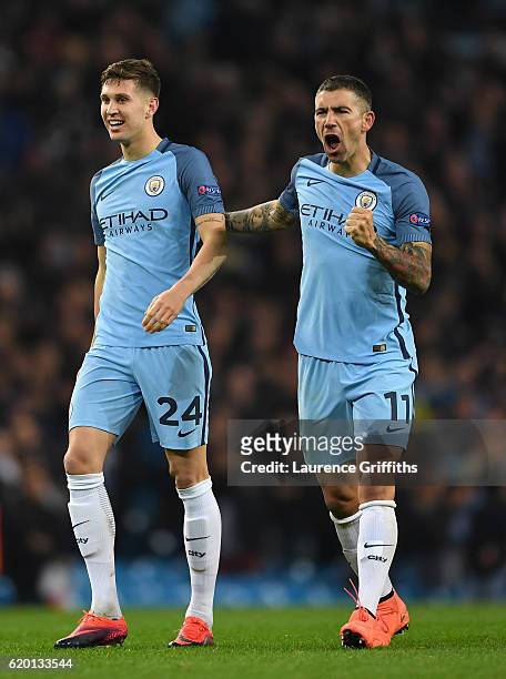 John Stones of Manchester City and Aleksander Kolorov of Manchester City celebrate their win after the final whistle during the UEFA Champions League...