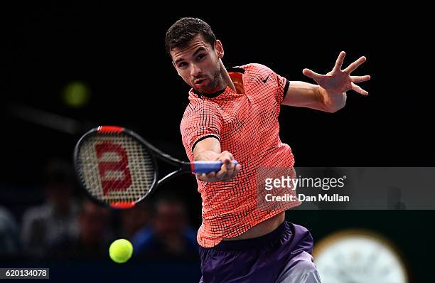 Grigor Dimitrov of Bulgaria plays a forehand against MArcos Baghdatis of Cyprus during the Mens Singles second round match on day two of the BNP...
