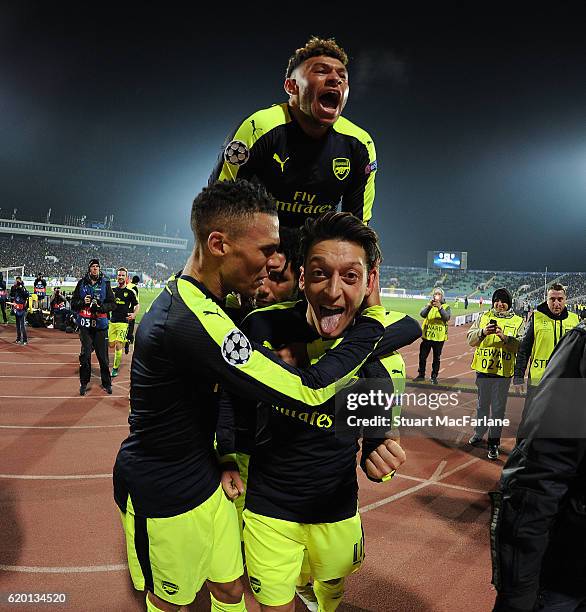 Mesut Ozil celebrates scoring the 3rd Arsenal goal with Kieran Gibbs, Mohamed Elneny and Alex Oxlade-Chamberlin during the UEFA Champions League...