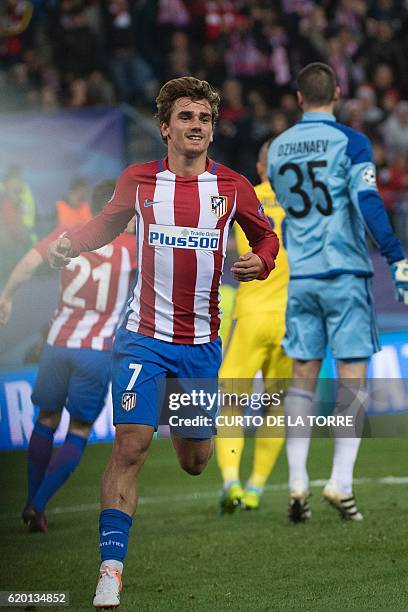 Atletico Madrid's French forward Antoine Griezmann celebrates after scoring during the UEFA Champions League Group D football match Club Atletico de...