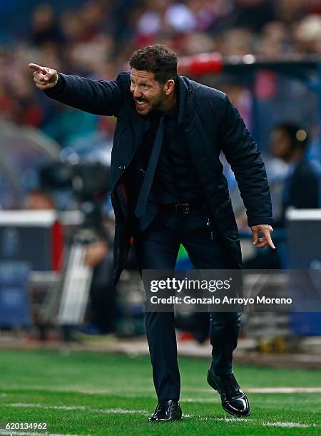 Diego Simeone, Manager of Atletico Madrid gives his team instructions during the UEFA Champions League Group D match between Club Atletico de Madrid...