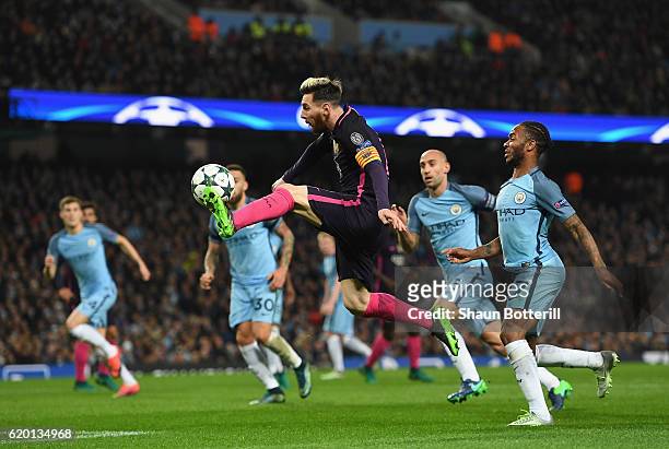 Lionel Messi of Barcelona volleys the ball during the UEFA Champions League match between Manchester City FC and FC Barcelona at Etihad Stadium on...