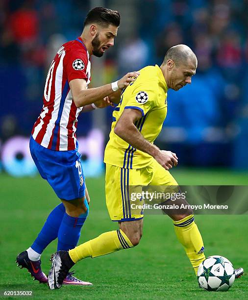 Yannick Ferreira Carrasco of Atletico Madrid puts pressure on Timofei Kalachev of FC Rostov during the UEFA Champions League Group D match between...