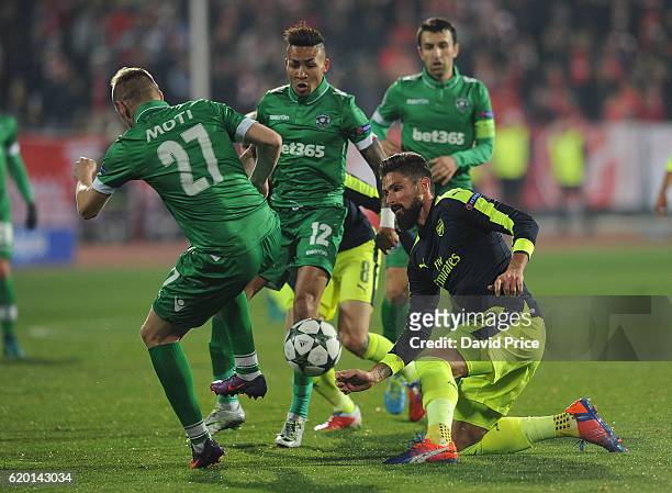 Olivier Giroud of Arsenal challenges Cosmin Moti of Ludogorets during the UEFA Champions League match between PFC Ludogorets Razgrad and Arsenal FC...