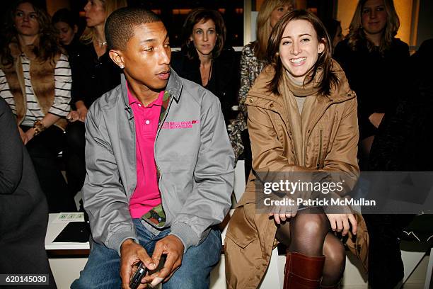 Pharrell Williams and Alexis Bryan attend TOMMY HILFIGER Fall 2008 Fashion Show at Avery Fisher Hall on February 7, 2008 in New York City.