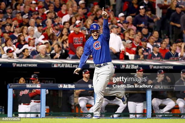 Anthony Rizzo of the Chicago Cubs celebrates after Addison Russell , hit a two-run RBI double during the first inning against the Cleveland Indians...