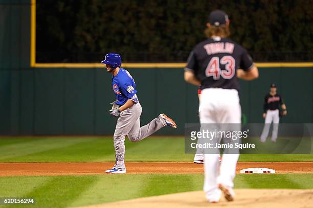 Kris Bryant of the Chicago Cubs rounds the bases after hitting a solo home run during the first inning against Josh Tomlin of the Cleveland Indians...