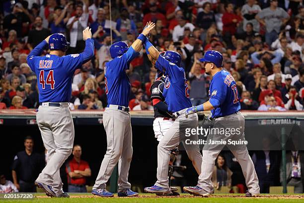 Addison Russell of the Chicago Cubs celebrates with Anthony Rizzo, Ben Zobrist and Kyle Schwarber after hitting a grand slam home run during the...