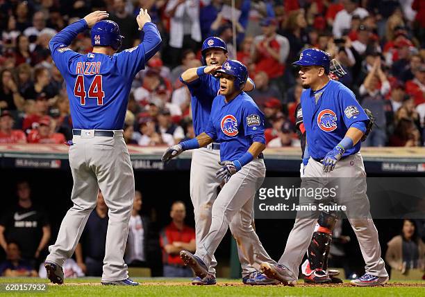 Addison Russell of the Chicago Cubs celebrates with Anthony Rizzo, Ben Zobrist and Kyle Schwarber after hitting a grand slam home run during the...