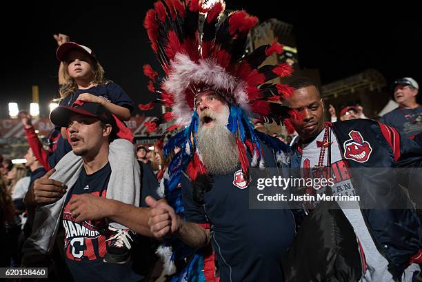 Paul Hollo of Cleveland wears his Indian headgear as he cheers on the Cleveland Indians outside of Progressive Field during game 6 of the World...