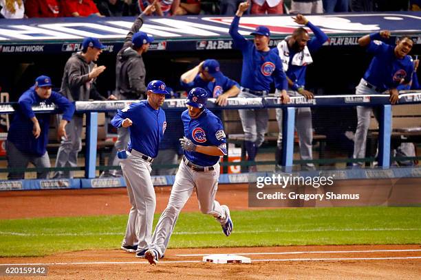 Kris Bryant of the Chicago Cubs rounds the bases after hitting a solo home run during the first inning against Josh Tomlin of the Cleveland Indians...