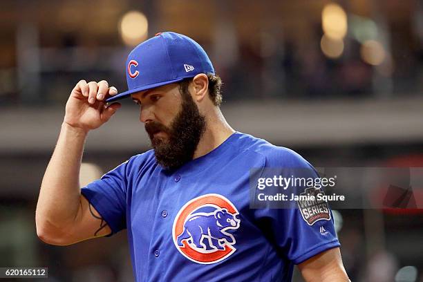 Jake Arrieta of the Chicago Cubs reacts after striking out Tyler Naquin of the Cleveland Indians with the bases loaded during the fourth inning in...