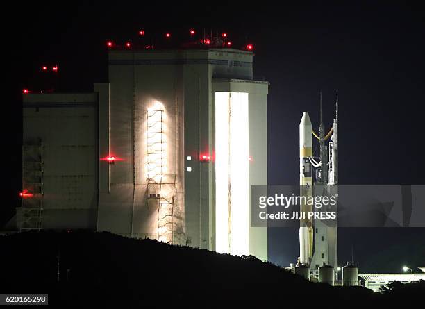 Japan's H-2A rocket is moved to the launch pad from an assembly building at the Tanegashima Space Center in Tanegashima Island in Kagoshima...