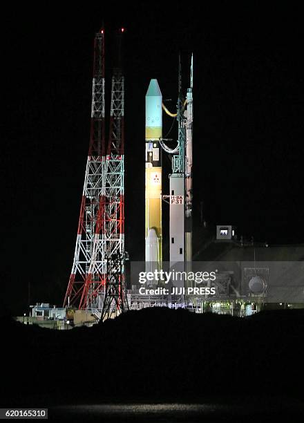 Japan's H-2A rocket is moved to the launch pad at the Tanegashima Space Center in Tanegashima Island in Kagoshima Prefecture on November 2, 2016....