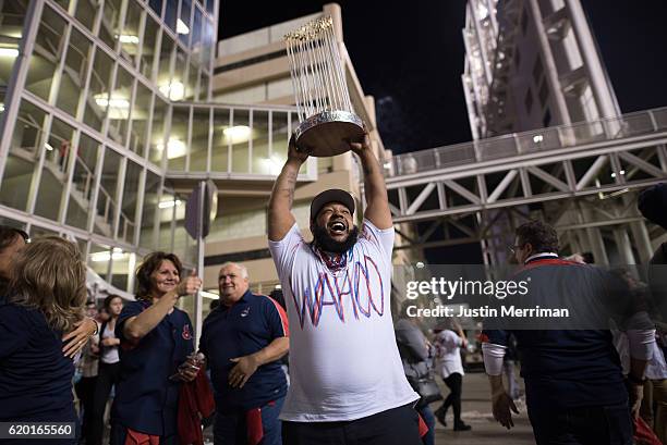 Demilles Jones of Cleveland holds a homemade World Series trophy outside of Progressive Field during game 6 of the World Series against the Chicago...