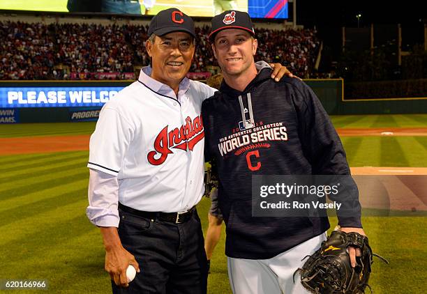 Former Indians pitcher Dennis Martinez poses with Yan Gomes of the Cleveland Indians after throwing out the ceremonial first pitch before Game 6 of...