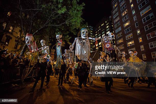 People dressed in Halloween costume take part in Halloween celebrations held within 43rd annual Village Halloween parade October 31, 2016 in New York.
