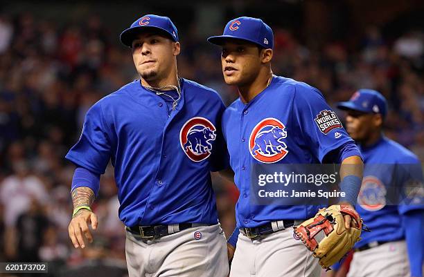 Javier Baez of the Chicago Cubs and Addison Russell react after the eighth inning against the Cleveland Indians in Game Six of the 2016 World Series...