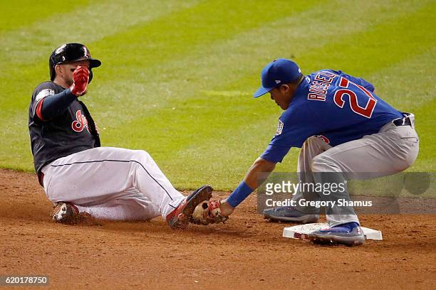 Addison Russell of the Chicago Cubs tags out Roberto Perez of the Cleveland Indians at second base during the ninth inning in Game Six of the 2016...