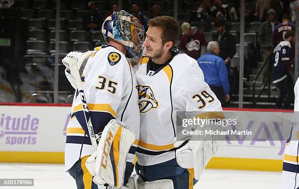 Goaltender Marek Mazanec of the Nashville Predators congratulates Goaltender Pekka Rinne after a win against the Colorado Avalanche at the Pepsi...