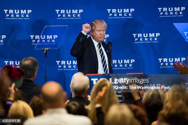 Republican presidential candidate Donald Trump holds up a fist after speaking during a campaign event at the DoubleTree by Hilton Philadelphia Valley...