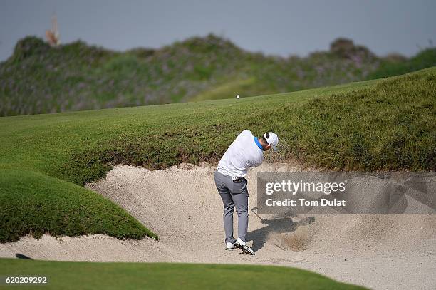 Garrick Porteous of England hits from a bunker during day one of the NBO Golf Classic Grand Final at Al Mouj Golf on November 2, 2016 in Muscat, Oman.