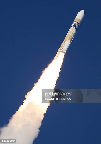 Japan's H-2A rocket, carrying a Himawari-9 weather satellite, is launched at the Tanegashima Space Center in Tanegashima Island in Kagoshima...
