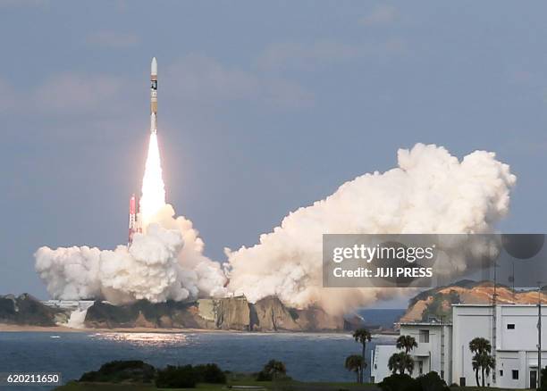 Japan's H-2A rocket, carrying a Himawari-9 weather satellite, is launched at the Tanegashima Space Center in Tanegashima Island in Kagoshima...