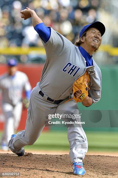 United States - Photo shows Kyuji Fujikawa of the Chicago Cubs pitching against the Pittsburgh Pirates during the ninth inning of their...