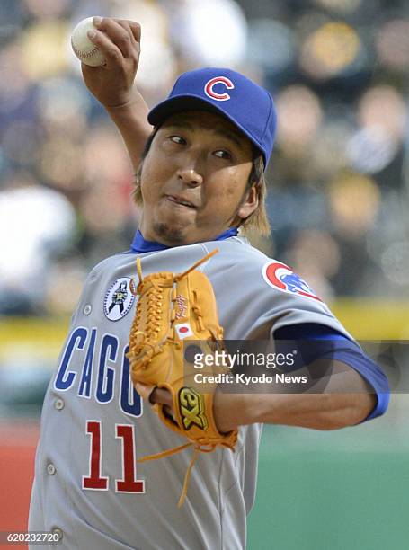 United States - Photo shows Kyuji Fujikawa of the Chicago Cubs pitching against the Pittsburgh Pirates during the ninth inning of their...