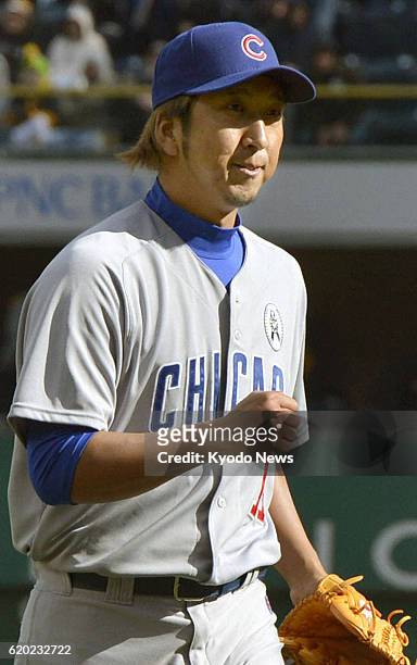 United States - Kyuji Fujikawa of the Chicago Cubs celebrates after getting a save against the Pittsburgh Pirates in their season-opening game at PNC...