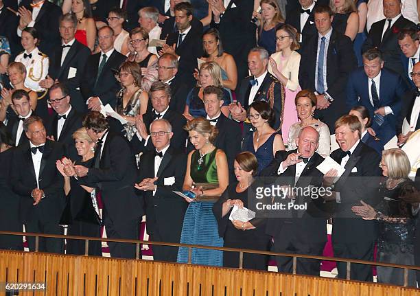 King Willem-Alexander of the Netherlands and his wife Queen Maxima stand next to Australian Prime Minister Malcolm Turnbull and his wife Lucy and...