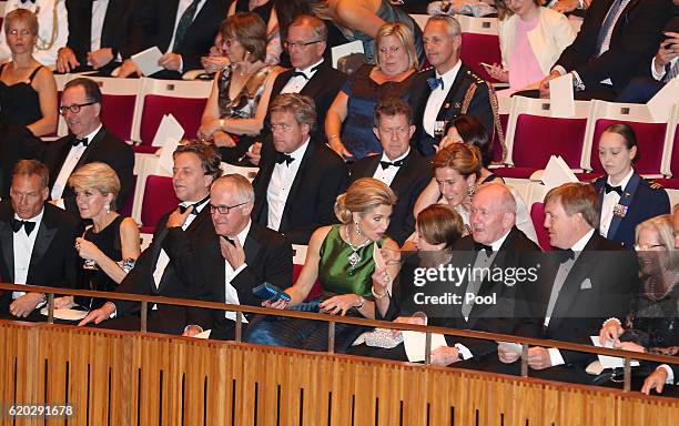 King Willem-Alexander of the Netherlands and his wife Queen Maxima sit next to Australian Prime Minister Malcolm Turnbull and his wife Lucy and...