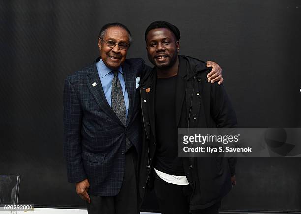 Clarence B Jones and Kewku Mandela pose during PTTOW! SESSIONS and WORLDZ Kickoff Party at Spring Place on November 1, 2016 in New York City.