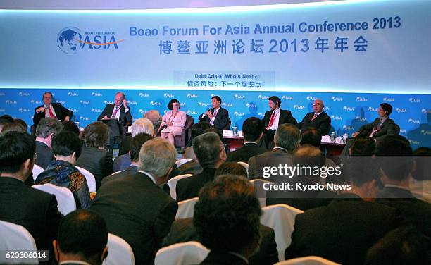 China - Economic experts hold discussions as an annual conference of the Boao Forum for Asia, a high-level brainstorming venue for leaders from...